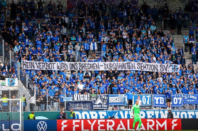 Hoffenheim Fans Banner Kein Verbot wird uns brechen - durchhalten Sektion SV! , FC Erzgebirge Aue vs. TSG Hoffenheim, Fussball, DFB Pokal, 1. Runde, Saison 2026 2027, 22.08.2026,¨ DFL REGULATIONS PROHIBIT ANY USE OF PHOTOGRAPHS AS IMAGE SEQUENCES AND OR QUASI-VIDEO,¨ FC Erzgebirge Aue vs. TSG Hoffenheim, Fussball, DFB Pokal, 1. Runde, Saison 2026 2027, 22.08.2026, Aue *** Hoffenheim Fans Banner: No ban will break us—we’ll keep going! Section SV, FC Erzgebirge Aue vs. TSG Hoffenheim, Soccer, DFB Cup, 1st Round, 2026–2027 Season, August 22, 2026, DFL regulations prohibit any use of photographs as image sequences and or quasi-video, FC Erzgebirge Aue vs. TSG Hoffenheim, Soccer, DFB Cup, Round 1, 2026–2027 Season, August 22, 2026, Aue Copyright: xEibner-Pressefoto LauraxRoemerx EP_LRR