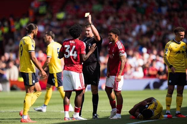 Referee Robert Jones shows Ola Aina of Nottingham Forest a yellow card Nottingham Forest v Leeds United, Premier League, Football, The City Ground, Nottingham, UK - 22 Aug 2026Nottingham The City Ground United Kingdom EDITORIAL USE ONLY No use with unauthorised audio, video, data, fixture lists, club league logos or live services. Online in-match use limited to 120 images, no video emulation. No use in betting, games or single club league player publications.  Copyright: xWiredxPhotos Shutterstockx 17112526a