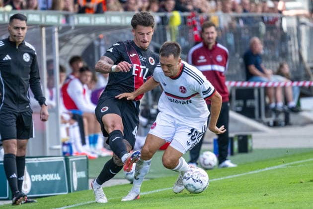 Zweikampf zwischen Niklas Castelle (Viktoria Koeln, 44) und Julian Justvan (1. FC Nuernberg, 10). Viktoria Koeln vs. 1. FC Nuernberg, Fussball, DFB-Pokal, 1. Runde, Saison 2026 2027, 22.08.2026 DFL DFB Regulations prohibit any use of Photographs as image sequences and or Quasivideo Viktoria Koeln vs. 1. FC Nuernberg, Fussball, DFB-Pokal, 1. Runde, Saison 2026 2027, 22.08.2026 Koeln *** Tackle between Niklas Castelle of Viktoria Cologne, 44, and Julian Justvan of 1. FC Nuremberg, 10; Viktoria Cologne vs. 1. FC Nuremberg, Soccer, DFB Cup, 1st Round, 2026–2027 Season, August 22, 2026. DFL and DFB regulations prohibit any use of photographs as image sequences and or quasi-video. Viktoria Cologne vs. 1. FC Nuremberg, soccer, DFB Cup, Round 1, 2026–2027 season, August 22, 2026, Cologne Copyright: xEibner-Pressefoto ThomasxHaeslerx EP_THR