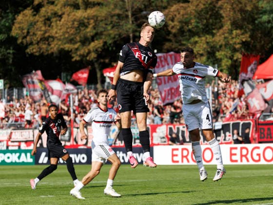 KOELN, GERMANY - AUGUST 22, 2026: Tim Kloss (Viktoria Koeln, 18) with a header against Alexios Kalogeropoulos (1. FC Nuernberg, 4) during the DFB-Cup match between Viktoria Koeln vs. 1. FC Nuernberg at the Sportpark Hoehenberg on August 22, 2026 in Koeln, Germany. DFL REGULATIONS PROHIBIT ANY USE OF PHOTOGRAPHS AS IMAGE SEQUENCES AND OR QUASI-VIDEO. Nordrhein-Westfalen Germany Copyright: xAxelxKohringx