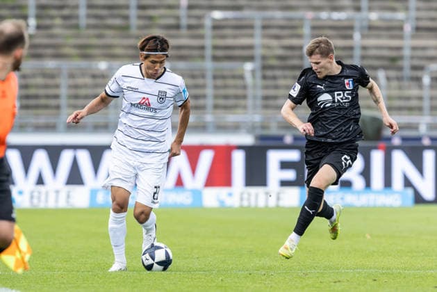 SSV Ulm 1846 Fußball vs. SG Barockstadt Fulda-Lehnerz, Fussball, Regionalliga Südwest, 3. Spieltag, Donaustadion Ulm 22.08.26 v.l. Masaaki Takahara (SSV Ulm 1846 Fußball, 23), Sebastian Schmitt (SG Barockstadt Fulda-Lehnerz, 22) SSV Ulm 1846 Fußball vs. SG Barockstadt Fulda-Lehnerz, Fussball, Regionalliga Südwest, 3. Spieltag, Donaustadion Ulm 22.08.26 Foto: Lucca Fundel Ulm Donaustadion Baden-Württemberg Deutschland *** SSV Ulm 1846 Soccer vs. SG Barockstadt Fulda Lehnerz, Soccer, Regionalliga Southwest, Matchday 3, Donaustadion Ulm, August 22, 2026, Masaaki Takahara, SSV Ulm 1846 Soccer, 23, Sebastian Schmitt, SG Barockstadt Fulda Lehnerz, 22 SSV Ulm 1846 Soccer vs. SG Barockstadt Fulda Lehnerz, Soccer, Southwest Regional League, Matchday 3, Donaustadion Ulm, August 22, 2026; Photo by Lucca Fundel, Ulm, Donaustadion, Baden-Württemberg, Germany