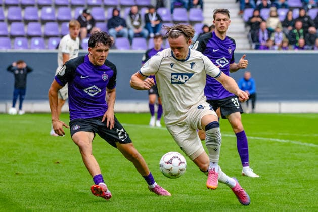 Maxim Burghardt (FC Erzgebirge Aue, 21) und Patrick Wimmer (TSG 1899 Hoffenheim, 08) am Ball, Zweikampf, Duell, Kampf, FC Erzgebirge Aue vs. TSG Hoffenheim, Fussball, DFB Pokal, 1. Runde, Saison 2026 2027, 22.08.2026,¨ DFL REGULATIONS PROHIBIT ANY USE OF PHOTOGRAPHS AS IMAGE SEQUENCES AND OR QUASI-VIDEO,¨ FC Erzgebirge Aue vs. TSG Hoffenheim, Fussball, DFB Pokal, 1. Runde, Saison 2026 2027, 22.08.2026, Aue *** Maxim Burghardt (FC Erzgebirge Aue), 21, and Patrick Wimmer (TSG 1899 Hoffenheim), 08, in action; tackle, duel, battle; FC Erzgebirge Aue vs. TSG Hoffenheim; soccer; DFB Cup; Round 1, 2026–2027 season, August 22, 2026, DFL regulations prohibit any use of photographs as image sequences and or quasi-video, FC Erzgebirge Aue vs. TSG Hoffenheim, soccer, DFB Cup, Round 1, 2026–2027 season, August 22, 2026, Aue Copyright: xEibner-Pressefoto LauraxRoemerx EP_LRR