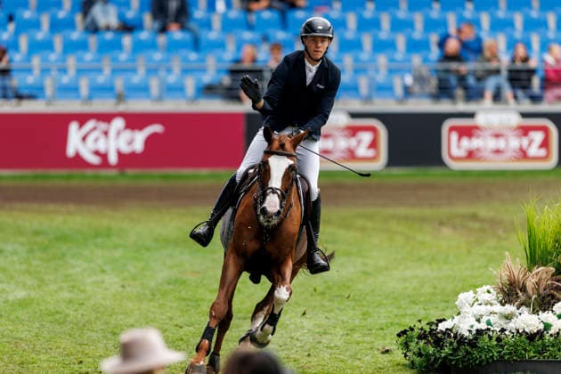 AACHEN - FEI World Championships 2026, AACHEN - FEI World Championships 2026 AHLMANN Hannes (GER), Madness Stechen Jump-Off RWE-Prize Final German U25 Trophy of the Stiftung Deutscher Pferdesport and Holger Hetzel Aachen, Reitstadion Soers 22. August 2026 - *** 2026 FEI World Championships in Aachen, AACHEN FEI World Championships 2026: Hannes Ahlmann (GER) on Madness in the Jump-Off of the RWE Prize Final, German U25 Trophy of the Stiftung Deutscher Pferdesport, and Holger Hetzel, Aachen, Reitstadion Soers, August 22, 2026