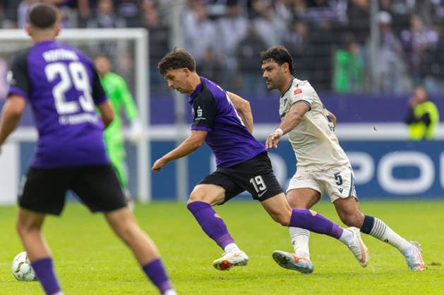 GER, Aue, Fussball, DFB-Pokal, 1. Hauptrunde, FC Erzgebirge Aue vs. TSG 1899 Hoffenheim im Bild v.l.: Christoph Pauling (FC Erzgebirge Aue 19), Ozan Kabak (TSG Hoffenheim 05), Zweikampf 22.08.2026, EINS Erzgebirgsstadion Aue DFB REGULATIONS PROHIBIT ANY USE OF PHOTOGRAPHS AS IMAGE SEQUENCES AND OR QUASI-VIDEO, *** GER, Aue, Soccer, DFB Cup, 1st Round, FC Erzgebirge Aue vs. TSG 1899 Hoffenheim (pictured, from left): Christoph Pauling (FC Erzgebirge Aue 19), Ozan Kabak (TSG Hoffenheim 05), tackle on August 22, 2026, EINS Erzgebirgsstadion Aue DFB REGULATIONS PROHIBIT ANY USE OF PHOTOGRAPHS AS IMAGE SEQUENCES AND OR QUASI-VIDEO, Copyright: HMBxMedia PaulxFritz