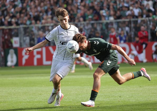 Duell zwischen Olivier Deman (SV Werder Bremen) und Tjark Doerr (Lueneburger SK Hansa) Fussball, Saison 2026 2027, Maenner, Herren, DFB Pokal, 1. Hauptrunde, Millerntor Stadion, Lueneburger SK gegen Werder BremenÂ , 0-3 DFL REGULATIONS PROHIBIT ANY USE OF PHOTOGRAPHS AS IMAGE SEQUENCES AND OR QUASI-VIDEO. *** Match between Olivier Deman of SV Werder Bremen and Tjark Doerr of Lüneburger SK Hansa, 2026–2027 season, Men’s, DFB Cup, 1st Round, Millerntor Stadium, Lüneburger SK vs. Werder Bremen, 0–3. DFL regulations prohibit any use of photographs as image sequences and or quasi-video.