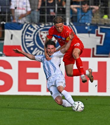RECORD DATE NOT STATED 22.08.2026, Fussball DFB-Pokal 2026 27, 1.Runde, TSV 1860 München - Holstein Kiel, im Stadion an der Grünwalderstrasse in München, Lance Fiedler (1860 München) gegen Jonas Therkelsen (Holstein Kiel) . ***DFL and DFB regulations prohibit any use of photographs as image sequences and or quasi-video.*** *** August 22, 2026, Soccer: 2026–27 DFB Cup, First Round, TSV 1860 Munich vs. Holstein Kiel, at the Grünwalderstrasse Stadium in Munich, Lance Fiedler (1860 Munich) vs. Jonas Therkelsen (Holstein Kiel) ***DFL and DFB regulations prohibit any use of photographs as image sequences and or quasi-video***