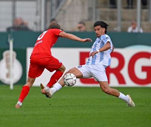 RECORD DATE NOT STATED 22.08.2026, Fussball DFB-Pokal 2026 27, 1.Runde, TSV 1860 München - Holstein Kiel, im Stadion an der Grünwalderstrasse in München, v.l. Jonas Therkelsen (Holstein Kiel) gegen Tunay Deniz (TSV 1860 München) ***DFL and DFB regulations prohibit any use of photographs as image sequences and or quasi-video.*** *** August 22, 2026, Soccer: 2026–27 DFB Cup, First Round, TSV 1860 Munich vs. Holstein Kiel, at the Stadion an der Grünwalderstrasse in Munich; from left: Jonas Therkelsen (Holstein Kiel) vs. Tunay Deniz (TSV 1860 Munich) ***DFL and DFB regulations prohibit any use of photographs as image sequences and or quasi-video***
