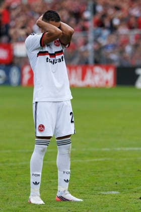 KOELN, GERMANY - AUGUST 22, 2026: Giannis Masouras (1. FC Nuernberg, 21) gestures after failing a penalty during the shootout during the DFB-Cup match between Viktoria Koeln vs. 1. FC Nuernberg at the Sportpark Hoehenberg on August 22, 2026 in Koeln, Germany. DFL REGULATIONS PROHIBIT ANY USE OF PHOTOGRAPHS AS IMAGE SEQUENCES AND OR QUASI-VIDEO. Nordrhein-Westfalen Germany Copyright: xAxelxKohringx