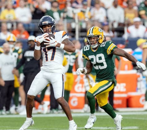 August 22, 2026, Denver, Colorado, USA: Broncos WR JALEN WADDLE catches a pass during the 1st. Half with Packers SXAVIER MCKINNEY closes in at Empower Field at Mile High Friday evening. Packers beat the Broncos in Pre-Season 33-13. Credit Image: ZUMA Press Wire) Denver USA - ZUMAav4_ 20260822_zaf_av4_004 Copyright: xHectorxAcevedox