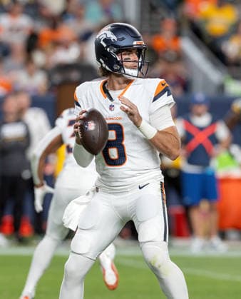 August 22, 2026, Denver, Colorado, USA: Broncos QB JARRETT STIDHAM readies to throw a pass during the 1st. Half at Empower Field at Mile High Friday evening. Packers beat the Broncos in Pre-Season 33-13. Credit Image: ZUMA Press Wire) Denver USA - ZUMAav4_ 20260822_zaf_av4_008 Copyright: xHectorxAcevedox
