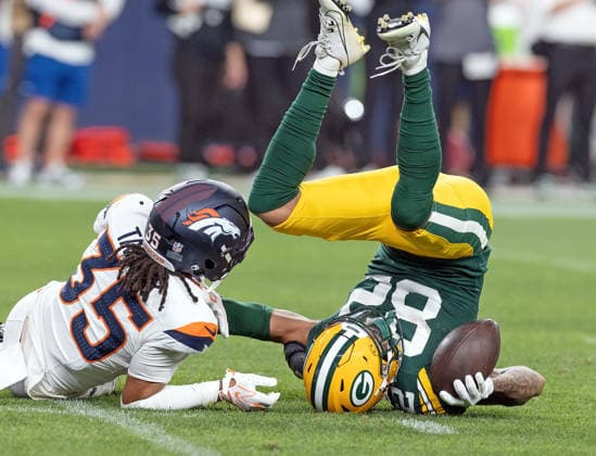 August 22, 2026, Denver, Colorado, USA: Packers WILL SHEPPARD gets thrown to the turf after catch during the 2nd. Half at Empower Field at Mile High Friday evening. Packers beat the Broncos in Pre-Season 33-13. Credit Image: ZUMA Press Wire) Denver USA - ZUMAav4_ 20260822_zaf_av4_026 Copyright: xHectorxAcevedox