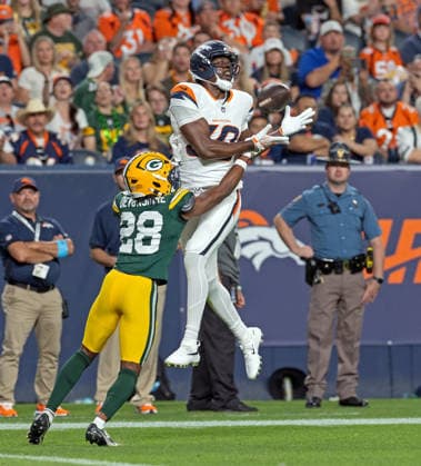 August 22, 2026, Denver, Colorado, USA: Broncos WR HAKEEM BUTLER goes up for a pass with Packers CB TREY SMACK during the 2nd. Half at Empower Field at Mile High Friday evening. Packers beat the Broncos in Pre-Season 33-13. Credit Image: ZUMA Press Wire) Denver USA - ZUMAav4_ 20260822_zaf_av4_037 Copyright: xHectorxAcevedox