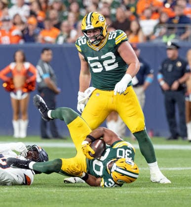 August 22, 2026, Denver, Colorado, USA: Packers RB CHRIS BROOKS gets dumped to the ground by a Broncos defender during the 2nd. Half at Empower Field at Mile High Friday evening. Packers beat the Broncos in Pre-Season 33-13. Credit Image: ZUMA Press Wire) Denver USA - ZUMAav4_ 20260822_zaf_av4_045 Copyright: xHectorxAcevedox