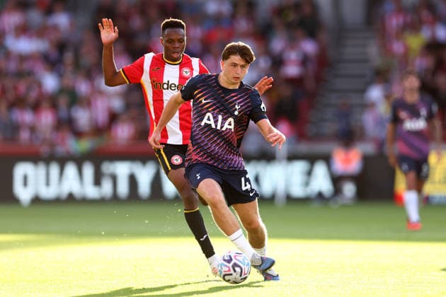London, England, 22nd August 2026. Mikey Moore of Tottenham Hotspur with the ball ahead of Mamadou Sangare of Brentford during the Brentford vs Tottenham Hotspur Premier League match at Gtech Community Stadium, London. Picture credit should read: Paul Terry Sportimage EDITORIAL USE ONLY. No use with unauthorised audio, video, data, fixture lists, club league logos or live services. Online in-match use limited to 120 images, no video emulation. No use in betting, games or single club league player publications. SPI_031_PT_Brentford_Tottenham SPI-4927-0031