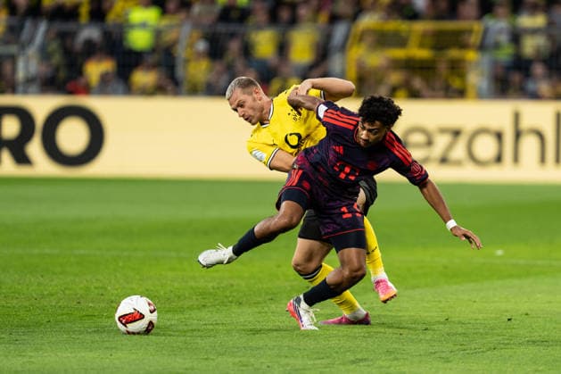 22.08.2026, GER Deutschland, Fussball, Saison 2026 2027, Franz Beckenbauer Supercup - Borussia Dortmund vs FC Bayern München Muenchen Zweikampf zwischen Nathaniel Brown (FC Bayern München Muenchen, 11) und Julian Ryerson (Borussia Dortmund, 26) Dortmund Signal Iduna Park Nordrhein-Westfalen (NRW) Deutschland *** August 22, 2026, GER Germany, Soccer, 2026–2027 season, Franz Beckenbauer Super Cup: Borussia Dortmund vs. FC Bayern Munich. Head-to-head matchup between Nathaniel Brown (FC Bayern Munich, age 11) and Julian Ryerson (Borussia Dortmund, age 26). Signal Iduna Park, Dortmund, North Rhine-Westphalia (NRW), Germany Copyright: xnordphotoxGmbHx xChristianxSchulzex