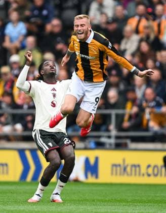 Ayden Heaven of Manchester United, ManU fouls Oliver McBurnie of Hull City Hull City v Manchester United, Premier League Football, Football, MKM Stadium, Hull, UK - 22 Aug 2026Hull MKM Stadium United Kingdom EDITORIAL USE ONLY No use with unauthorised audio, video, data, fixture lists, club league logos or live services. Online in-match use limited to 120 images, no video emulation. No use in betting, games or single club league player publications.  Copyright: xGreigxCowie Shutterstockx 17111325fv