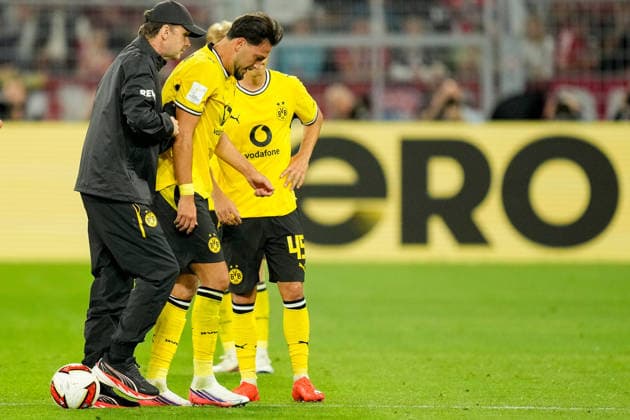 Ramy Bensebaini (Borussia Dortmund) receives medical treatment during the Franz Beckenbauer Supercup match between Borussia Dortmund and FC Bayern Muenchen at Signal Iduna Park on August 22, 2026 in Dortmund, Germany. (Photo by Alex Gottschalk DeFodi Images) - *** Ramy Bensebaini of Borussia Dortmund receives medical treatment during the Franz Beckenbauer Super Cup match between Borussia Dortmund and FC Bayern Munich at Signal Iduna Park on August 22, 2026, in Dortmund, Germany. Photo by Alex Gottschalk, DeFodi Images
