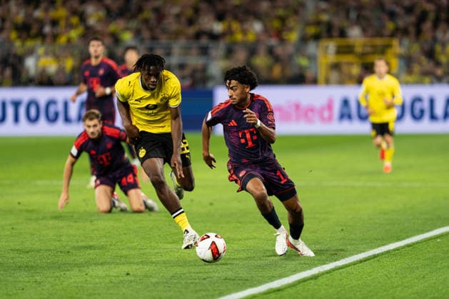 22.08.2026, GER Deutschland, Fussball, Saison 2026 2027, Franz Beckenbauer Supercup - Borussia Dortmund vs FC Bayern München Muenchen Zweikampf zwischen Nathaniel Brown (FC Bayern München Muenchen, 11) und Joane Gadou (Borussia Dortmund, 22) Dortmund Signal Iduna Park Nordrhein-Westfalen (NRW) Deutschland *** August 22, 2026, GER Germany, Soccer, 2026–2027 season, Franz Beckenbauer Super Cup: Borussia Dortmund vs. FC Bayern Munich, duel between Nathaniel Brown (FC Bayern Munich), 11, and Joane Gadou (Borussia Dortmund), 22, at Signal Iduna Park in Dortmund, North Rhine-Westphalia (NRW), Germany Copyright: xnordphotoxGmbHx xChristianxSchulzex