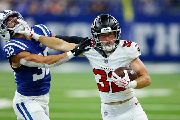 INDIANAPOLIS, IN - AUGUST 22: Atlanta Falcons running back Cash Jones (32) with the stiff arm to Indianapolis Colts safety Daniel Scott (32) in the second half of play during a pre season game between the Atlanta Falcons and the Indianapolis Colts on August 22, 2026 at Lucas Oil Stadium in Indianapolis, IN. (Photo by Jeffrey Brown Icon Sportswire) NFL, American Football Herren, USA AUG 22 Falcons at Colts EDITORIAL USE ONLY Icon082226023