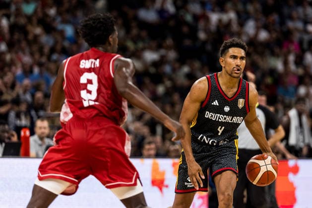 HAMBURG, GERMANY - AUGUST 22: Maodo Lo (Germany, 4) controls the ball against Jaleen Smith (Croatia, 3) during the Turkish Airlines Basketball Supercup final match between Germany vs. Croatia at Barclays Arena on August 22, 2026 in Hamburg, Germany. Hamburg Germany Copyright: xSteffiexWunderlx