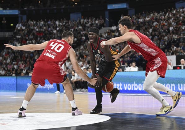 Germany v Croatia - Turkish Airlines Supercup 2026 HAMBURG, GERMANY - AUGUST 22: Germany s Isaac Bonga (C) in action during the Turkish Airlines Basketball Supercup 2026 match between Germany and Croatia at Barclays Arena in Hamburg, Germany, on August 22, 2026. Halil Sagirkaya Anadolu Hamburg Germany. Editorial use only. Please get in touch for any other usage.  Copyright: x2026xAnadoluxHalilxSagirkayax