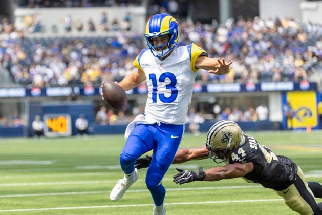 August 22, 2026, Inglewood, California, USA: Los Angeles Rams Quarterback Stetson Bennett IV (13) scores a touchdown against New Orleans Saints Running Back CJ Donaldson (44) during an NFL, American Football Herren, USA football preseason game, in Inglewood, Calif. on Saturday August 22, 2026. Inglewood USA - ZUMAc68_ 20260822_zaf_c68_030 Copyright: xRingoxChiux
