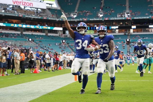 MIAMI GARDENS, FL - AUGUST 22: New York Giants kicker Dominic Zvada (34) and New York Giants linebacker Darius Muasau (53) celebrate a fumble recovery in the second half during the preseason NFL, American Football Herren, USA game between the New York Giants and the Miami Dolphins on Saturday, August 22, 2026 at Hard Rock Stadium in Miami, FL (Photo by Peter Joneleit Icon Sportswire) NFL: AUG 22 Giants at Dolphins EDITORIAL USE ONLY Icon260822004
