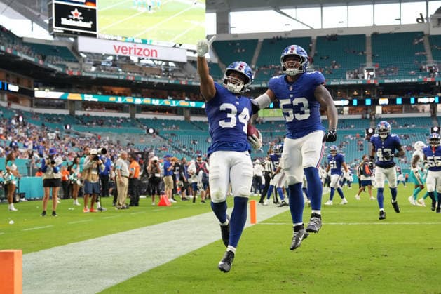 MIAMI GARDENS, FL - AUGUST 22: New York Giants kicker Dominic Zvada (34) and New York Giants linebacker Darius Muasau (53) celebrate a fumble recovery in the second half during the preseason NFL, American Football Herren, USA game between the New York Giants and the Miami Dolphins on Saturday, August 22, 2026 at Hard Rock Stadium in Miami, FL (Photo by Peter Joneleit Icon Sportswire) NFL: AUG 22 Giants at Dolphins EDITORIAL USE ONLY Icon260822005