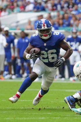 MIAMI GARDENS, FL - AUGUST 22: New York Giants running back Devin Singletary (26) rushes with the ball in the first half during the preseason NFL, American Football Herren, USA game between the New York Giants and the Miami Dolphins on Saturday, August 22, 2026 at Hard Rock Stadium in Miami, FL (Photo by Peter Joneleit Icon Sportswire) NFL: AUG 22 Giants at Dolphins EDITORIAL USE ONLY Icon260822011