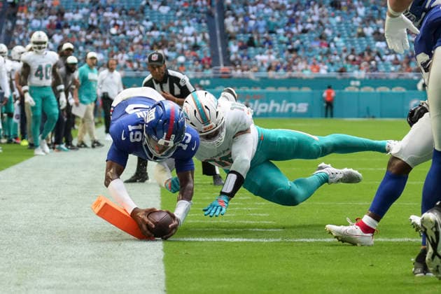 MIAMI GARDENS, FL - AUGUST 22: New York Giants quarterback Jameis Winston (19) dives for a touchdown as Miami Dolphins linebacker Jacob Rodriguez (10) defends in the first half during the preseason NFL, American Football Herren, USA game between the New York Giants and the Miami Dolphins on Saturday, August 22, 2026 at Hard Rock Stadium in Miami, FL (Photo by Peter Joneleit Icon Sportswire) NFL: AUG 22 Giants at Dolphins EDITORIAL USE ONLY Icon260822015