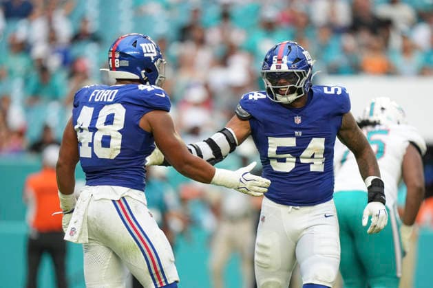 MIAMI GARDENS, FL - AUGUST 22: New York Giants defensive lineman Khalid Kareem (54) and New York Giants tight end Tanner Conner (48) celebrates after a Miami Dolphins fumble in the second half during the preseason NFL, American Football Herren, USA game between the New York Giants and the Miami Dolphins on Saturday, August 22, 2026 at Hard Rock Stadium in Miami, FL (Photo by Peter Joneleit Icon Sportswire) NFL: AUG 22 Giants at Dolphins EDITORIAL USE ONLY Icon260822055