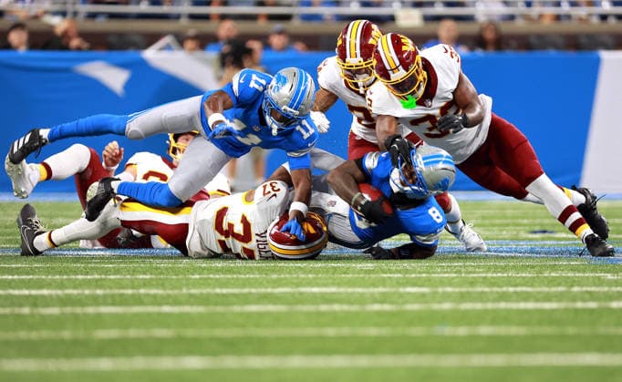 Washington Commanders vs Detroit Lions DETROIT,MICHIGAN-AUGUST 22: Detroit Lions wide receiver Greg Dortch (8) is tackled by Washington Commanders cornerback Car lin Vigers (37), Washington Commanders safety Qwuantrezz Knight (32) and Washington Commanders running back Craig Reynolds (24) during the second half of an NFL, American Football Herren, USA preseason football game between the Washington Commanders and the Detroit Lions in Detroit, Michigan USA, on Saturday, August 22, 2026 Detroit Michigan United States  Copyright: xAmyxLemusx originalFilename:lemus-washingt260822_npIaA.jpg