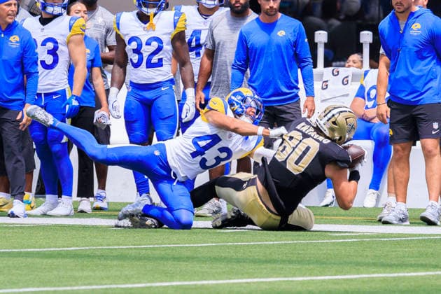 August 22, 2026, Inglewood, California, USA: 80 Moliki Matavao, TE of the New Orleans Saints completes a pass as 43 Nate Valcarcel, S of the Los Angeles Rams tackles him during their regular NFL, American Football Herren, USA season game on Saturday August 22, 2026 at SoFi Stadium in Inglewood, California. Rams defeat Saints, 34-0. ARIANA RUIZ PI Inglewood USA - ZUMAp124 20260822_zaa_p124_062 Copyright: xArianaxRuizx