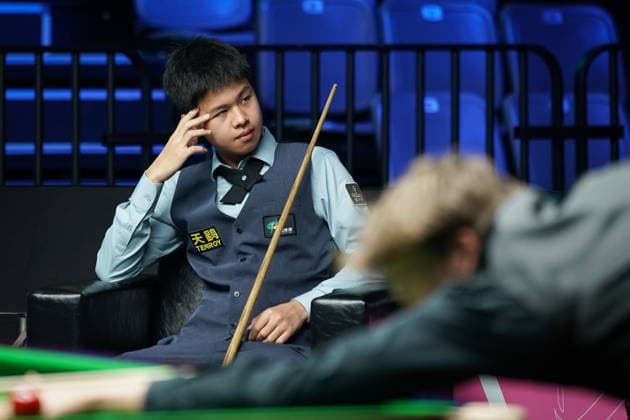 WUHAN, CHINA - AUGUST 23: Wang Xinzhong of China reacts in the first round match against Ben Mertens of Belgium on day 1 of Wuhan Open 2026 at the Optics Valley Gymnasium of Huazhong University of Science and Technology on August 23, 2026 in Wuhan, Hubei Province of China.  Copyright: xTaixChengzhex 111661617833