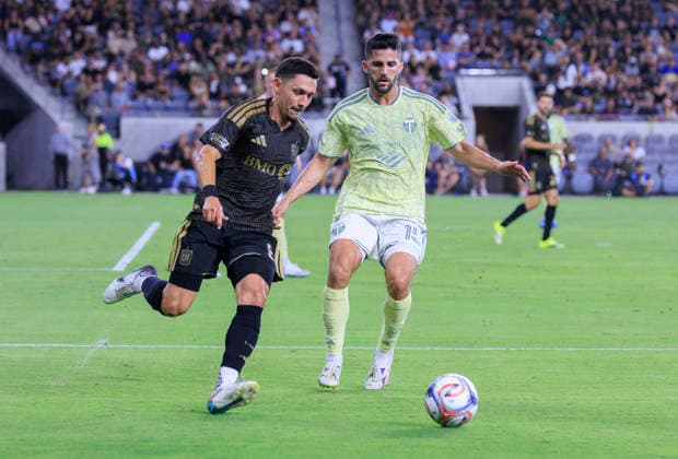 August 22, 2026, Los Angeles, California, USA: Mark Delgado 8 of the Los Angeles Football Club attempts to steal the ball from Eric Miller 15 of the Portland Timbers during their regular season MLS, Fussball Herren, USA game on Saturday August 22, 2026 at the BMO Stadium in Los Angeles, California. LAFC tie with Timbers, 1-1. ARIANA RUIZ PI Los Angeles USA - ZUMAp124 20260822_zaa_p124_091 Copyright: xArianaxRuizx