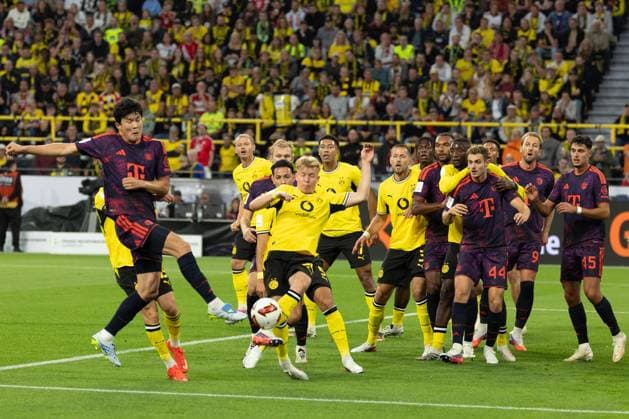 (260823) -- DORTMUND, Aug. 23, 2026 -- Kim Minjae (1st L) of FC Bayern Munich shoots during the Franz Beckenbauer Supercup 2026 football match between FC Bayern Munich and Borussia Dortmund in Dortmund, Germany, Aug. 22, 2026. (Photo by Xinhua) (SP)GERMANY-DORTMUND-FOOTBALL-SUPERCUP-MUNICH VS DORTMUND JoachimxBywaletz 