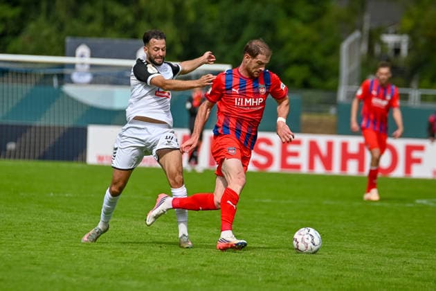 Budu Zivzivadze (1. FC Heidenheim, 11) gegen Kamer Krasniqi (SSV Jeddeloh II, 10) SSV Jeddeloh II vs. 1. FC Heidenheim, Fussball, DFB-Pokal, 1. Runde, Saison 2026 2027, 23.08.2026, SSV Jeddeloh II vs. 1. FC Heidenheim, Fussball, DFB-Pokal, 1. Runde, Saison 2026 2027, 23.08.2026 Oldenburg *** Budu Zivzivadze 1 FC Heidenheim, 11 vs. Kamer Krasniqi SSV Jeddeloh II, 10 SSV Jeddeloh II vs. 1 FC Heidenheim, Soccer, DFB Cup, 1st Round, 2026–2027 Season, August 23, 2026, SSV Jeddeloh II vs. 1 FC Heidenheim, Soccer, DFB Cup, Round 1, 2026–2027 Season, August 23, 2026, Oldenburg Copyright: xEibner-Pressefoto RobertxGertzenx EP_RGN