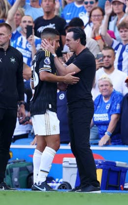 Brighton and Hove, England, 23rd August 2026. Following his red card Joao Gomes of Aston Villa is consoled by Unai Emery head coach of Aston Villa during the Brighton and Hove Albion vs Aston Villa Premier League match at the AMEX Stadium, Brighton and Hove. Picture credit should read: Paul Terry Sportimage EDITORIAL USE ONLY. No use with unauthorised audio, video, data, fixture lists, club league logos or live services. Online in-match use limited to 120 images, no video emulation. No use in betting, games or single club league player publications. SPI_017_PT_Brighton_Villa SPI-4931-0021