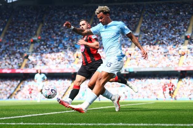 Nico O Reilly of Manchester City crosses past Lewis Cook of AFC Bournemouth Manchester City v AFC Bournemouth, Premier League Football, Football, Etihad Stadium, Manchester, UK - 23 Aug 2026Manchester Etihad Stadium United Kingdom EDITORIAL USE ONLY No use with unauthorised audio, video, data, fixture lists, club league logos or live services. Online in-match use limited to 120 images, no video emulation. No use in betting, games or single club league player publications.  Copyright: xPaulxCurrie Shutterstockx 17112312be