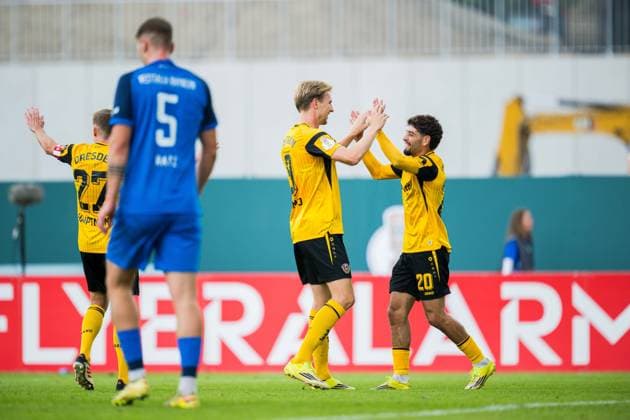 23.08.2026 - Fußball, 2026 2027, DFB-Pokal, 1. Hauptrunde, SV Westfalia Rhynern - SG Dynamo Dresden: (L-R) Vincent Vermeij (Dresden) jubelt nach seinem Tor zum 0:3 mit Ben Bobzien (Dresden) DFB REGULATIONS PROHIBIT ANY USE OF PHOTOGRAPHS AS IMAGE SEQUENCES AND OR QUASI-VIDEO. *** August 23, 2026 Soccer, 2026–2027, DFB Cup, 1st Round, SV Westfalia Rhynern vs. SG Dynamo Dresden, Referee Vincent Vermeij. Dresden celebrates after scoring the 0–3 goal with Ben Bobzien. Dresden. DFB regulations prohibit any use of photographs as image sequences and or quasi-video.