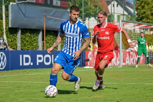 Mateusz Zukowski (1. FC Magdeburg, 22) am Ball vor Laurin Tost (Bahlinger SC, 05) GER, Bahlinger SC vs 1. FC Magdeburg, Fussball, DFB-Pokal, 1. Hauptrunde, Saison 2026 2027, 23.08.2026 DFB REGULATIONS PROHIBIT ANY USE OF PHOTOGRAPHS AS IMAGE SEQUENCES AND OR QUASI-VIDEO GER, Bahlinger SC vs 1. FC Magdeburg, Fussball, DFB-Pokal, 1. Hauptrunde, Saison 2026 2027, 23.08.2026 Bahlingen *** Mateusz Zukowski, 1 FC Magdeburg, No. 22 with the ball in front of Laurin Tost, Bahlinger SC, 05 GER, Bahlinger SC vs. 1 FC Magdeburg, Soccer, DFB Cup, 1st Round, 2026–2027 Season, August 23, 2026 DFB regulations prohibit any use of photographs as image sequences and or quasi-video GER, Bahlinger SC vs. 1 FC Magdeburg, Soccer, DFB Cup, 1st Main Round, 2026–2027 Season, August 23, 2026, Bahlingen Copyright: xEibner-Pressefotox EP_THS