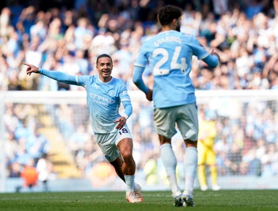 Manchester, England, 23rd August 2026. Jack Grealish of Manchester City points to the var screen to tell Josko Gvardiol of Manchester City has goal stands during the Manchester City vs AFC Bournemouth Premier League match at the Etihad Stadium, Manchester. Picture credit should read: Andrew Yates Sportimage EDITORIAL USE ONLY. No use with unauthorised audio, video, data, fixture lists, club league logos or live services. Online in-match use limited to 120 images, no video emulation. No use in betting, games or single club league player publications. SPI_064_AY_Man_City_Bournemouth SPI-4930-0062