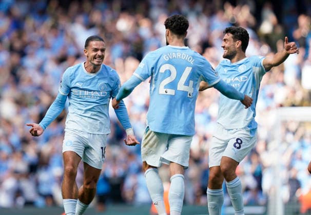Manchester, England, 23rd August 2026. Jack Grealish (l) and Mateo Kovacic of Manchester City (r) celebrate with scorer Josko Gvardiol of Manchester City during the Manchester City vs AFC Bournemouth Premier League match at the Etihad Stadium, Manchester. Picture credit should read: Andrew Yates Sportimage EDITORIAL USE ONLY. No use with unauthorised audio, video, data, fixture lists, club league logos or live services. Online in-match use limited to 120 images, no video emulation. No use in betting, games or single club league player publications. SPI_065_AY_Man_City_Bournemouth SPI-4930-0063