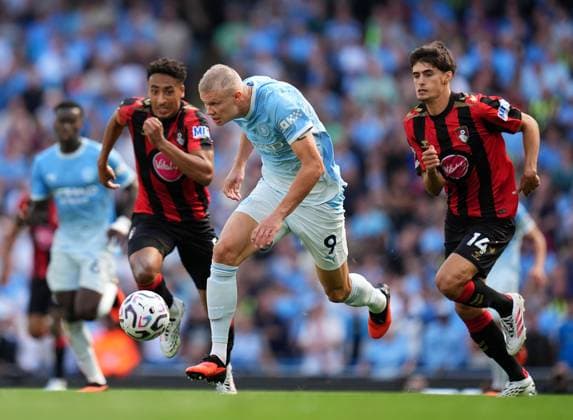 Erling Haaland of Manchester City gets away from Bournemouth defenders James Hill (left) and Antonio Silva (14) Manchester City v Bournemouth, Premier League, Football, Etihad Stadium, Manchester, UK - 23 Aug 2026Manchester Etihad Stadium United Kingdom EDITORIAL USE ONLY No use with unauthorised audio, video, data, fixture lists, club league logos or live services. Online in-match use limited to 120 images, no video emulation. No use in betting, games or single club league player publications.  Copyright: xWiredxPhotos Shutterstockx 17113667ce