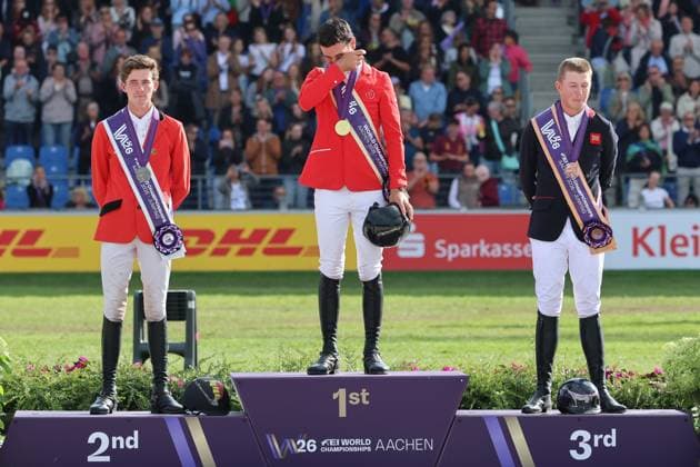 Siegerehrung, Tränen auf dem Podium, 1. Platz, Weltmeister Steve Guerdat (SUI, Schweiz) mit Pferd Dynamix de Belheme, 2. Platz Thibeau Spits (BEL, Belgien, Belgium) mit Pferd Impress-K vaunt Kattenheye Z , Harry Charles (GBR, Vereinigtes Königsreich, Großbritannien) mit Pferd LT Holst Freda, Springen, FEI Jumping World Championship, WM, Weltmeisterschaft , FEI Jumping World Championship, Competition Individual Final, Longines-Prize, Longines-Preis, Finale Einzelwertung, Jumping , AACHEN - FEI World Championships 2026, Weltfest des Pferdesports, Reitsport Weltmeisterschaft 2026, Aachen 2026, Welcome Home 2026, Aachener Soers, 11. bis 23. August 2026, Reitsport, 23.08.2026, Aachen Aachener Soers Deutschland *** Awards Ceremony, Tears on the Podium, 1st place: World Champion Steve Guerdat (SUI), Switzerland, riding Dynamix de Belheme; 2nd place: Thibeau Spits (BEL), Belgium, riding Impress K vaunt Kattenheye Z; Harry Charles (GBR), United Kingdom, riding LT Holst Freda; Show Jumping, FEI Jumping World Championship, FEI Jumping World Championship, Individual Final, Longines Prize, Longines Prize, Individual Final, Show Jumping, AACHEN FEI World Championships 2026, World Festival of Equestrian Sports, 2026 World Equestrian Games, Aachen 2026, Welcome Home 2026, Aachener Soers, August 11–23, 2026, Equestrian Sports, August 23, 2026, Aachen, Aachener Soers, Germany