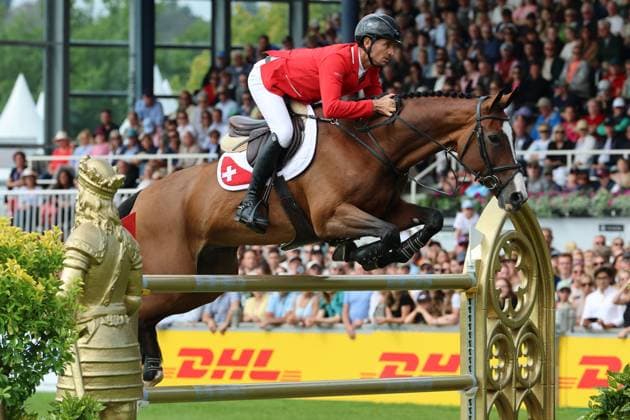 Weltmeister Steve Guerdat (SUI, Schweiz) mit Pferd Dynamix de Belheme am WM-Sprung , Springen, FEI Jumping World Championship, WM, Weltmeisterschaft , FEI Jumping World Championship, Competition Individual Final, Longines-Prize, Longines-Preis, Finale Einzelwertung, Jumping , AACHEN - FEI World Championships 2026, Weltfest des Pferdesports, Reitsport Weltmeisterschaft 2026, Aachen 2026, Welcome Home 2026, Aachener Soers, 11. bis 23. August 2026, Reitsport, 23.08.2026, Aachen Aachener Soers Deutschland *** World Champion Steve Guerdat (SUI, Switzerland) with his horse Dynamix de Belheme at the World Championships in Jumping, FEI Jumping World Championship, FEI Jumping World Championship, Individual Final, Longines Prize, Jumping, AACHEN FEI World Championships 2026, World Festival of Equestrian Sports, 2026 Equestrian World Championships, Aachen 2026, Welcome Home 2026, Aachen Soers, August 11–23, 2026, Equestrian Sports, August 23, 2026, Aachen Soers, Germany