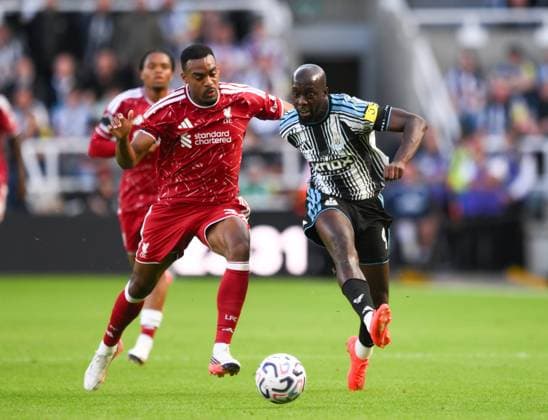 Yoane Wisse of Newcastle United fends off Ryan Gravenberch of Liverpool Newcastle United v Liverpool, Premier League Football, Football, St James Park, Newcastle, UK - 23 Aug 2026Newcastle St James Park United Kingdom EDITORIAL USE ONLY No use with unauthorised audio, video, data, fixture lists, club league logos or live services. Online in-match use limited to 120 images, no video emulation. No use in betting, games or single club league player publications.  Copyright: xRichardxLee Shutterstockx 17112314ay