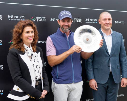 BALMEDIE, SCOTLAND - AUG 23: Scott Jamieson (SCO) receives the Nexo Trophy from Sarah Malone Head of the Trump International after Round 4 at the 2026 Nexo Championship at the Trump International Golf Links, Balmedie on August 23, 2026 in Aberdeenshire, Scotland The 2026 Nexo Championship