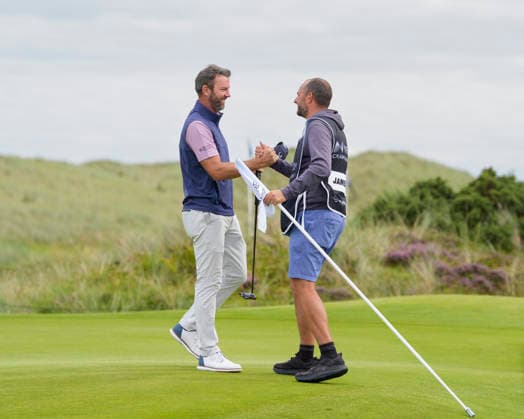 BALMEDIE, SCOTLAND - AUG 23: Scott Jamieson (SCO) celebrates with his caddie after winning the 2026 Nexo Championship at the Trump International Golf Links, Balmedie on August 23, 2026 in Aberdeenshire, Scotland The 2026 Nexo Championship