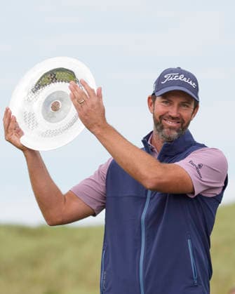 BALMEDIE, SCOTLAND - AUG 23: Scott Jamieson (SCO) hold the trophy aloft after winning The Nexo Championship during Round 4 at the 2026 Nexo Championship at the Trump International Golf Links, Balmedie on August 23, 2026 in Aberdeenshire, Scotland The 2026 Nexo Championship